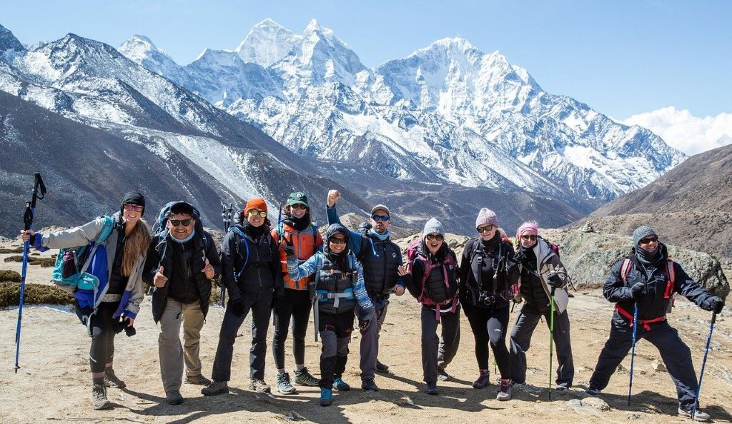 The climbers are infront of mountans