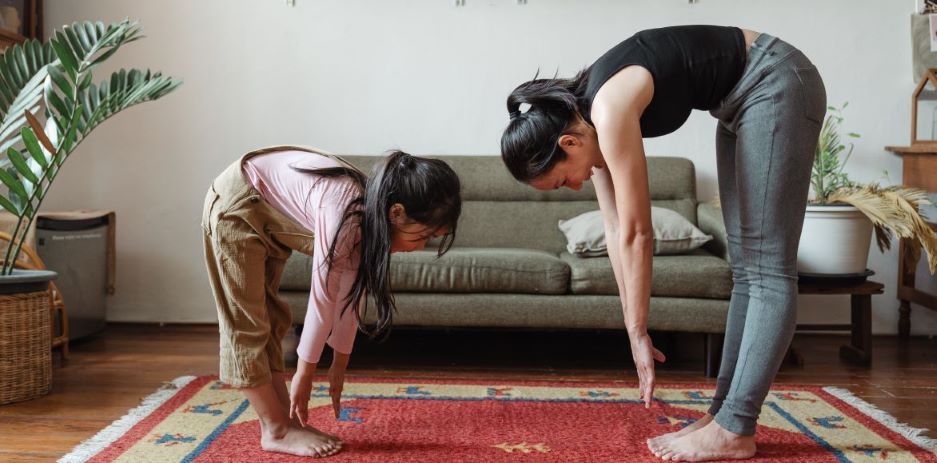 A girl and a woman doing exercise